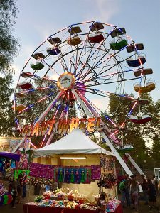 Carnival booth and Ferris Wheel amusement ride at the Clayton Oktoberfest