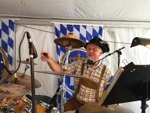 The Internationals drummer saluting the crowd in the beer garden tent at the Clayton Oktoberfest