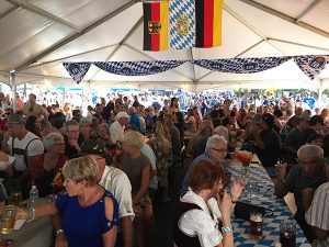 Festivities in the authentic German beer garden tent at the Clayton Oktoberfest